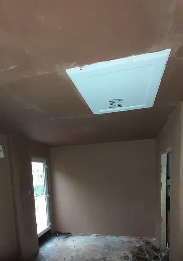Plastered ceiling with the new loft hatch