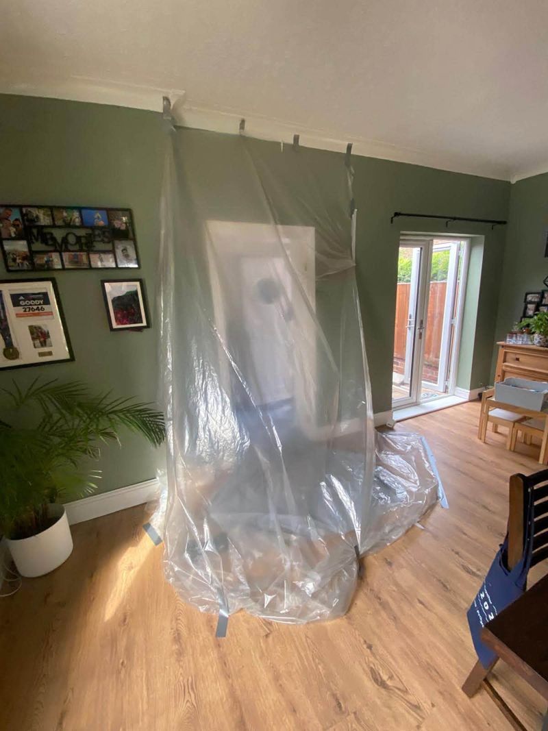 Dust sheeting hung across the opening while the work was carried out