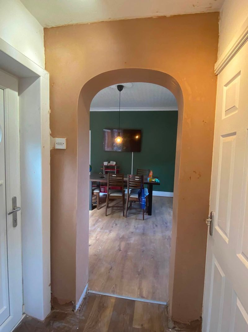 New plastered arched opening through to the dining room