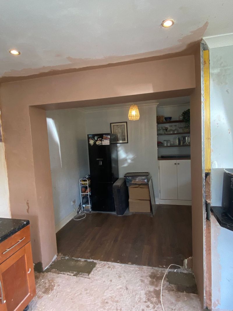 The new opening plastered, looking through to the room beyond