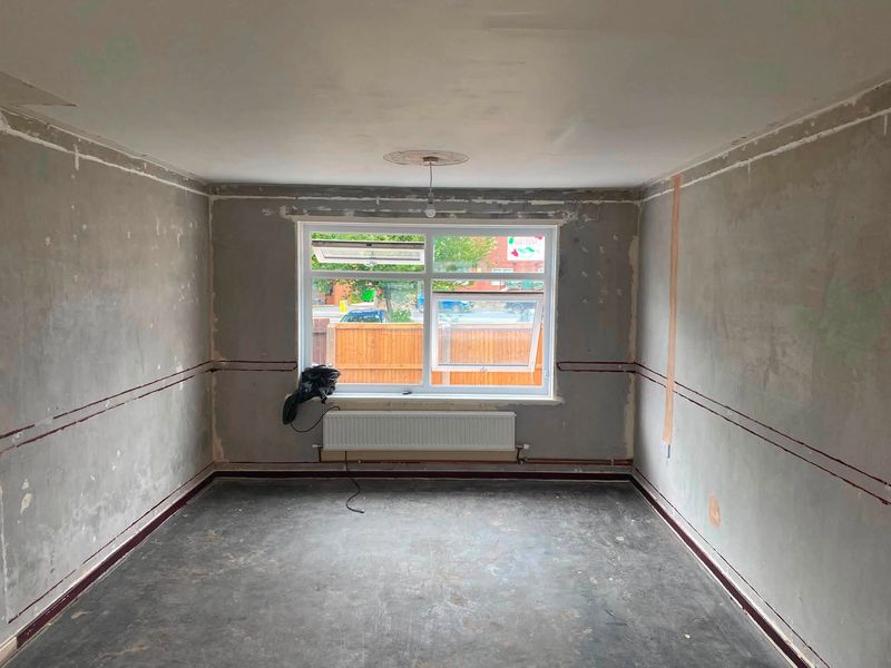 Empty living room before the new wall went in