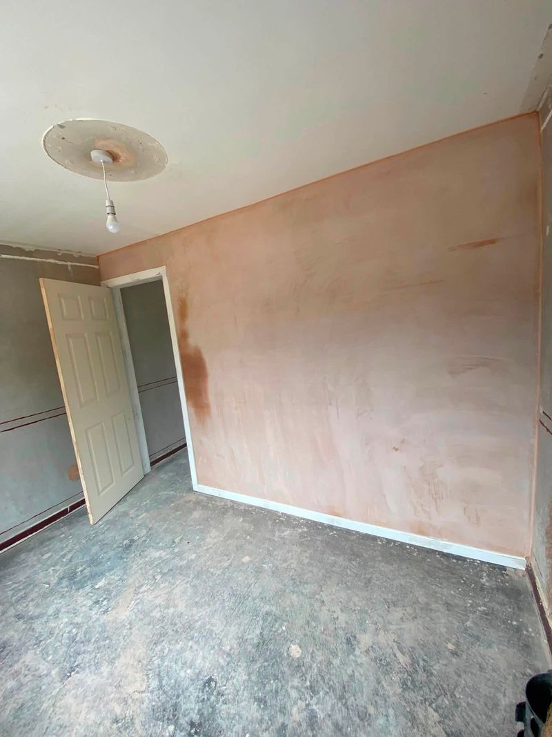 The new wall plastered, with skirting board and a new door fitted