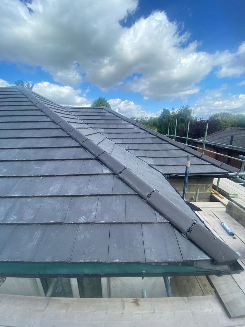 The finished hipped roof with new tiles and ridge