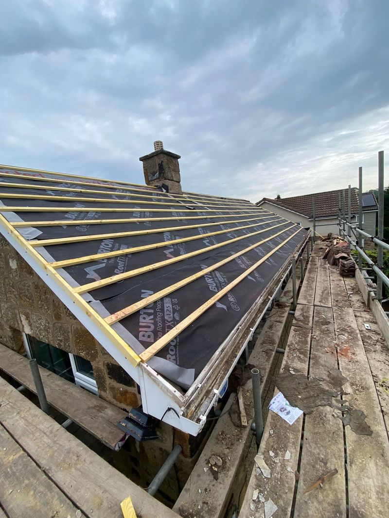 New breathable membrane and timber battens fixed across the roof slope